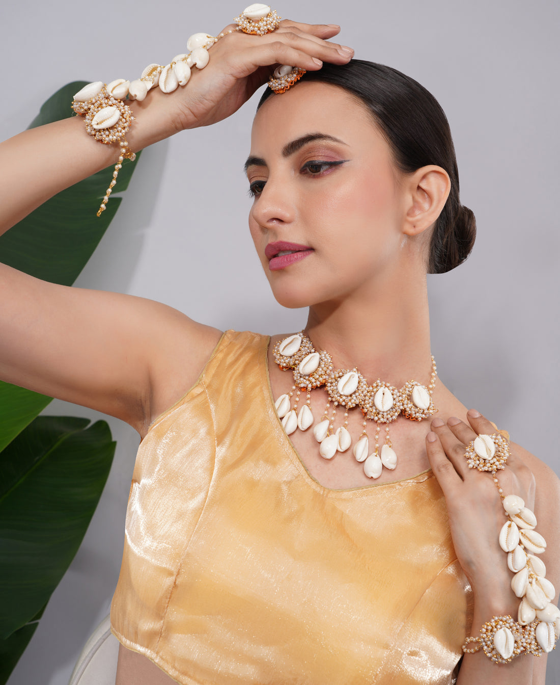 Amaita Gold Finish Shell Ghungroo Earring and Handpiece Set