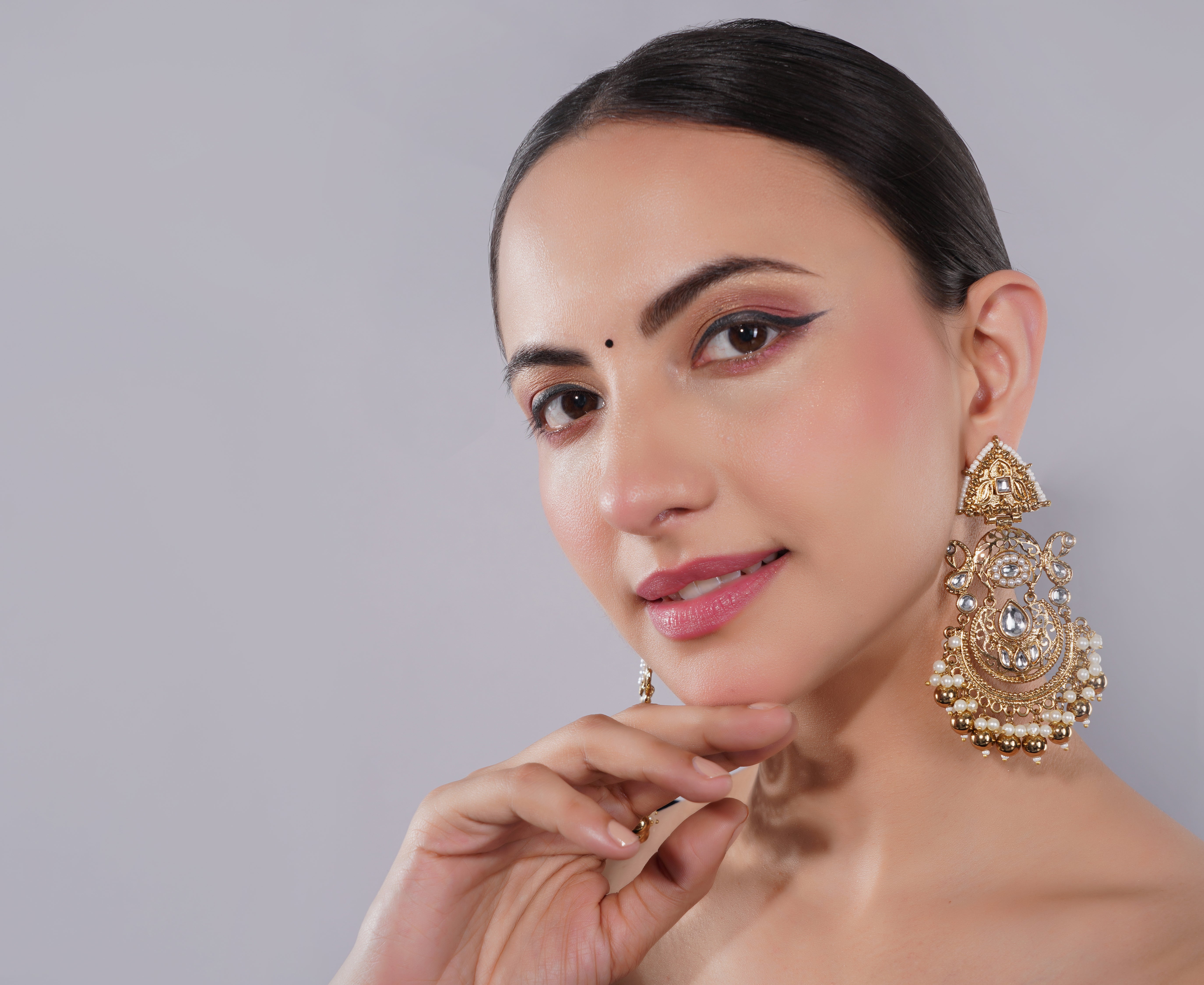 Amaita Gold-Finished Temple Jewellery Jhumka Earrings