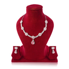 Jewelry set with necklace, earrings, and pink stones on a red velvet stand.