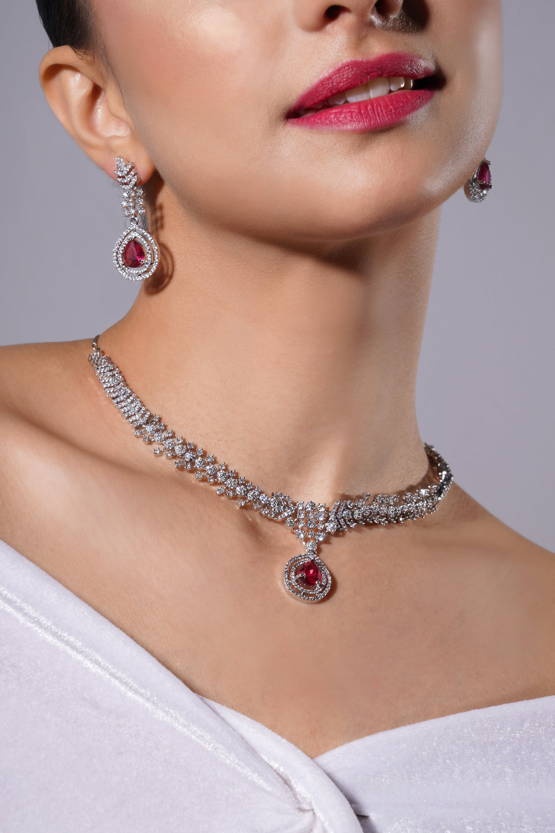 Amaita Platinum Finish Red Stone Vine Design Jewellery Set