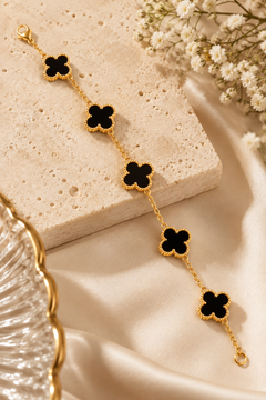 Amaita demi-fine black four-leaf clover charm bracelet with gold finish
