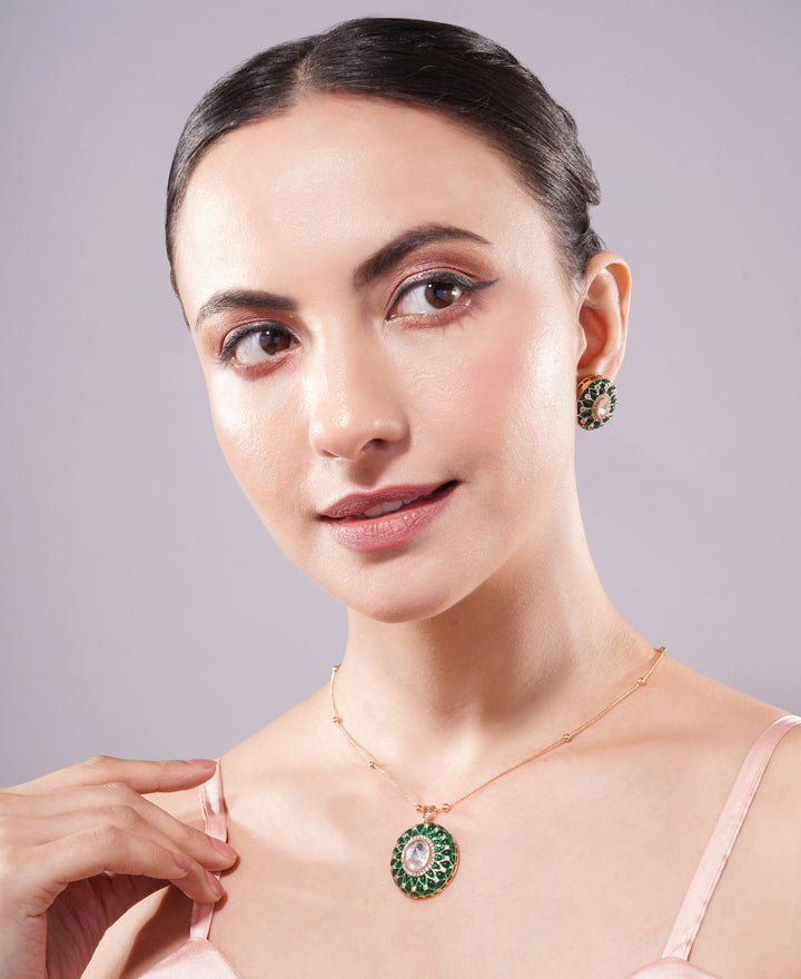 Woman wearing a necklace and earrings with a gray background