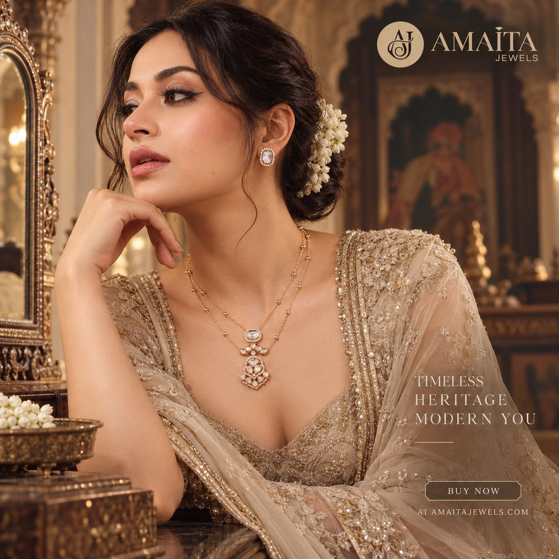 A woman in an ornate beige embellished traditional outfit wears a gold layered necklace and matching earring with white floral hair accessories, posed in a luxurious interior with gold-toned decor. Amaita Jewels branding and promotional text appear on the image.