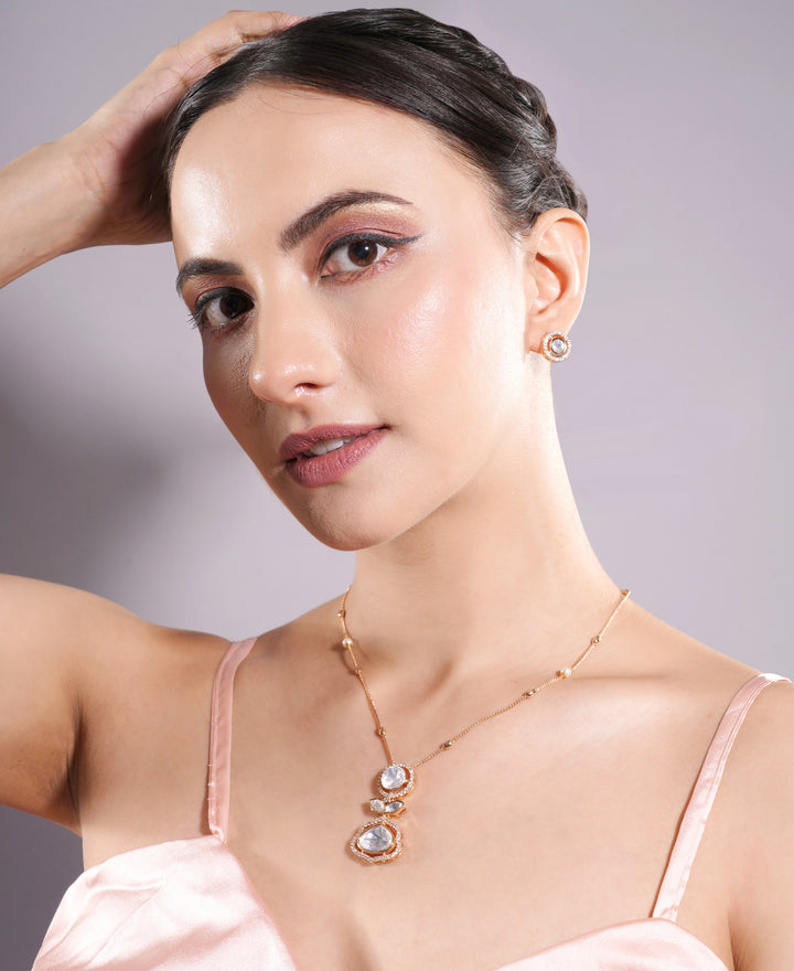 Woman wearing a necklace with a plain background