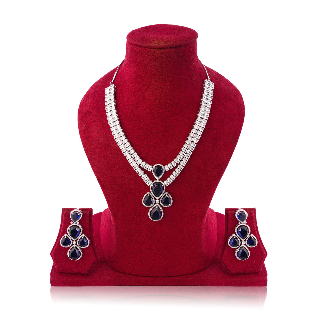 Jewelry set with necklace and earrings on a red velvet stand against a white background