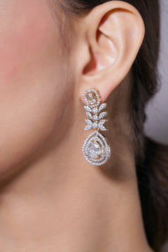 Close-up of a woman's ear wearing a sparkling earring.