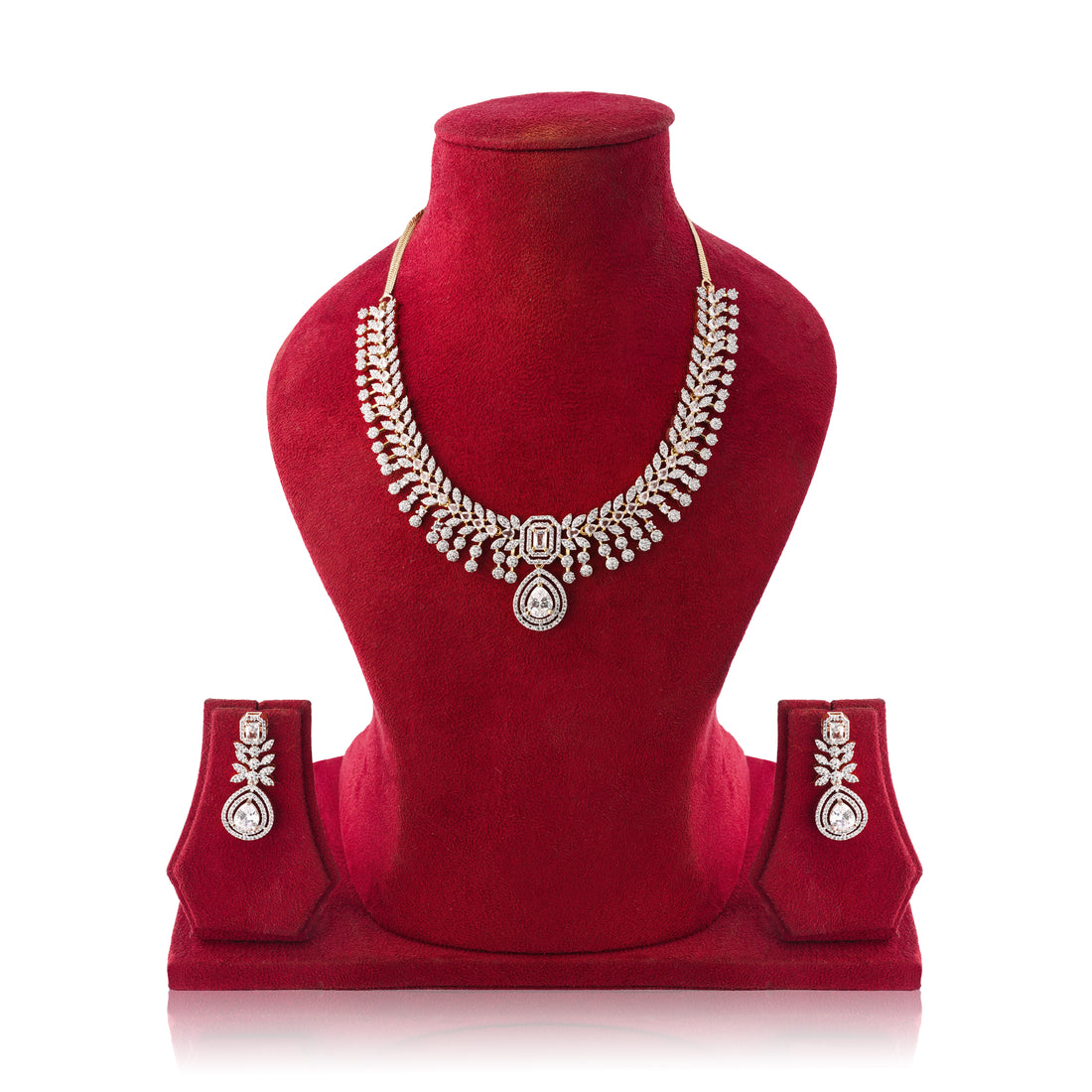 Jewelry set with necklace and earrings on a red velvet stand against a white background