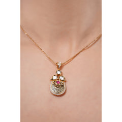 Gold necklace with a pendant on a mannequin